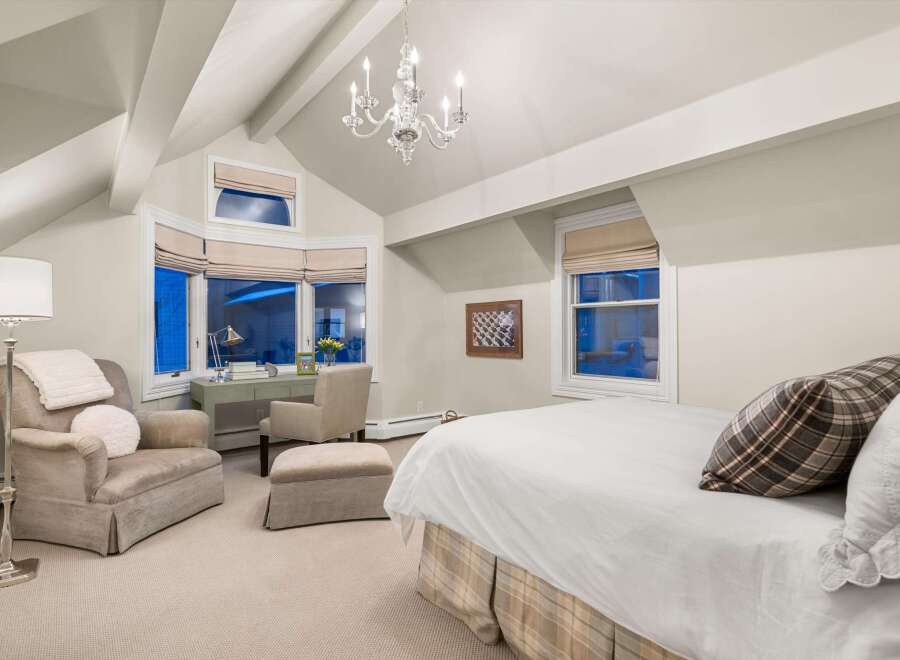 This stunning bedroom boasts a sophisticated design with a touch of elegance.