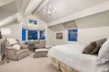 This stunning bedroom boasts a sophisticated design with a touch of elegance.