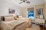 This inviting bedroom features two twin beds, perfect for guests or a shared space.