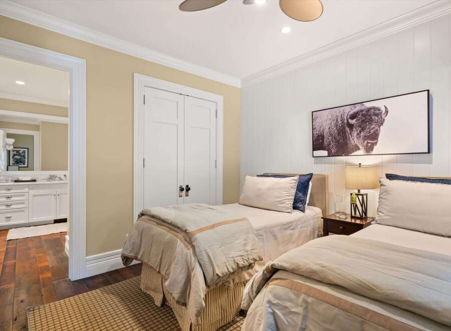 This inviting bedroom features two twin beds, perfect for guests or a shared living space.