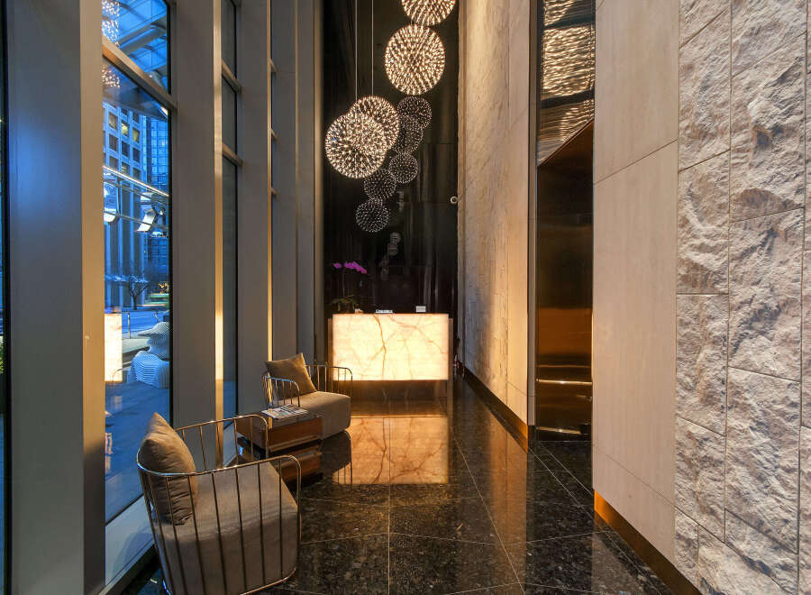 Step into luxury with this stunning lobby featuring modern design and elegant finishes.