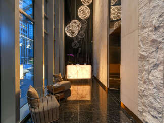Step into luxury with this stunning lobby featuring modern design and elegant finishes.