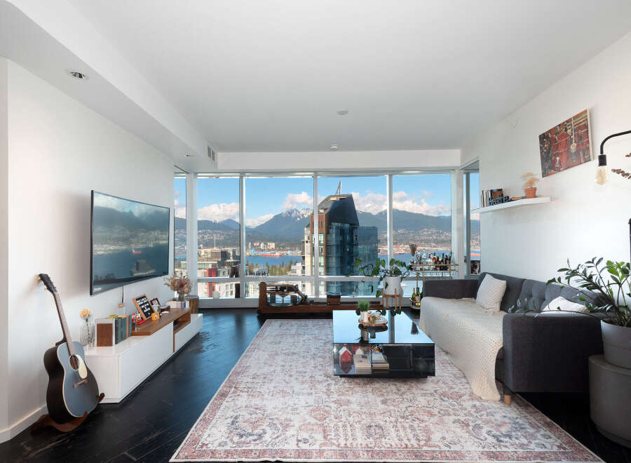 Experience luxury living in this stunning condo with breathtaking city and mountain views.