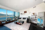 Experience luxury living in this stunning apartment with breathtaking city and water views.