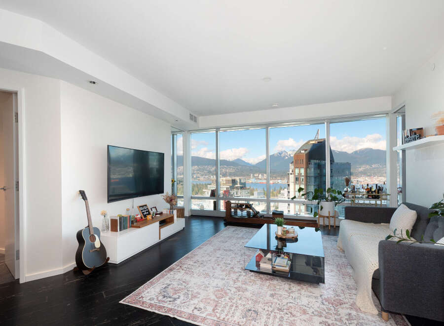 Experience luxury living in this stunning condo with breathtaking city and mountain views.
