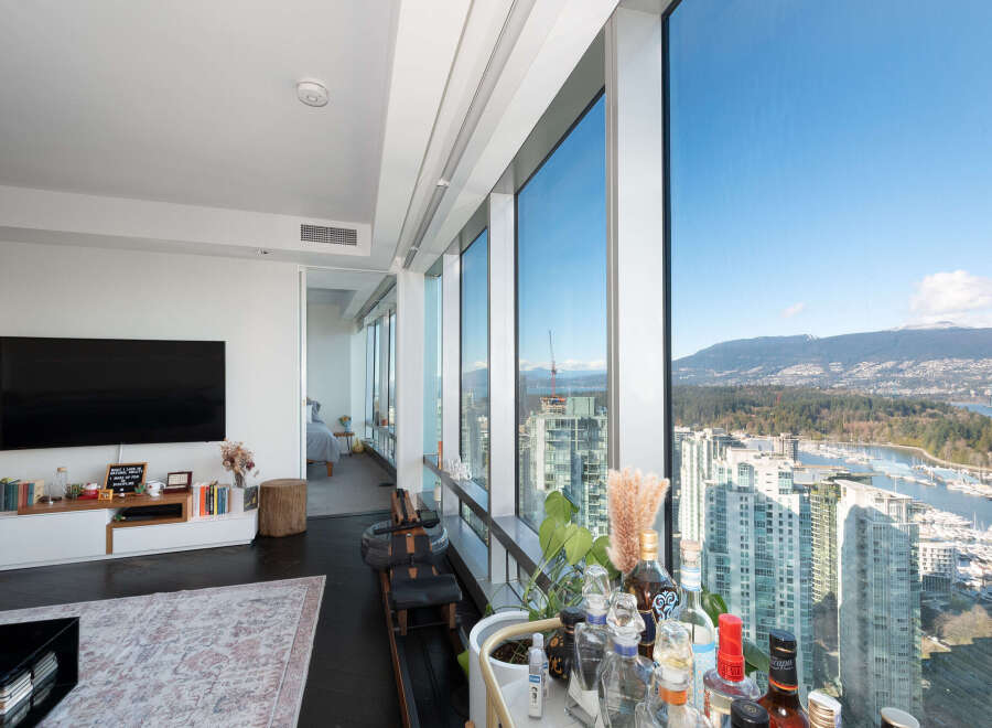 Experience luxury living in this stunning high-rise condo with breathtaking city and mountain views.