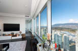 Experience luxury living in this stunning high-rise condo with breathtaking city and mountain views.