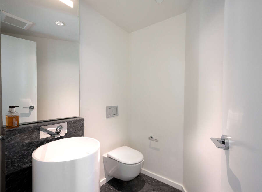 Step into a modern oasis with this sleek bathroom design.