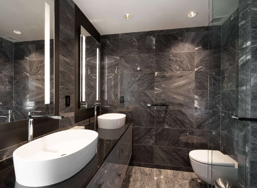 Experience luxury in this modern bathroom featuring sleek design and high-end finishes.