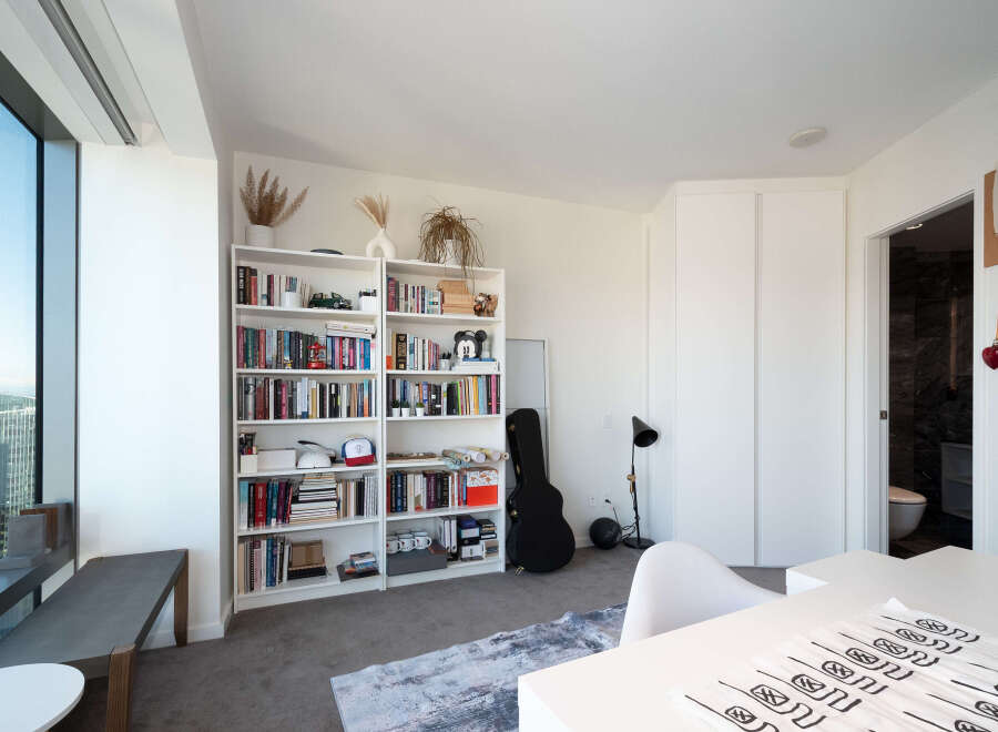 This modern apartment boasts a bright and airy living space, perfect for urban living.