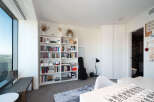 This modern apartment boasts a bright and airy living space, perfect for urban living.