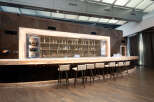 This stunning bar area features a sleek, modern design with high-end finishes.