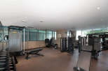 This modern gym offers a comprehensive fitness experience with a variety of state-of-the-art equipment.