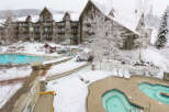 Experience the ultimate winter getaway at this stunning property! Featuring a beautiful outdoor pool and hot tub area, perfect for relaxing after a day on the slopes.