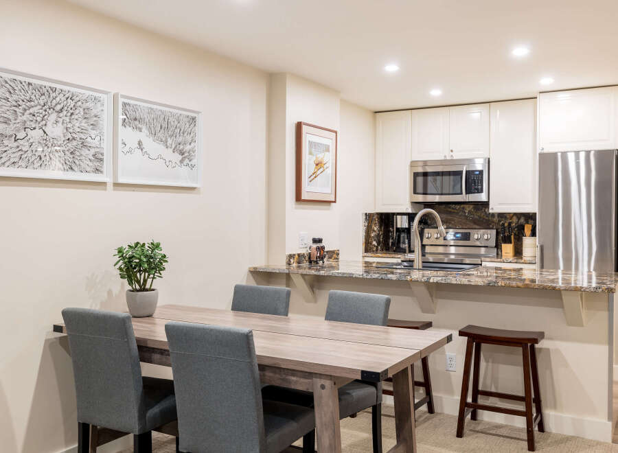 This stunning kitchen and dining area offers a perfect blend of style and functionality.