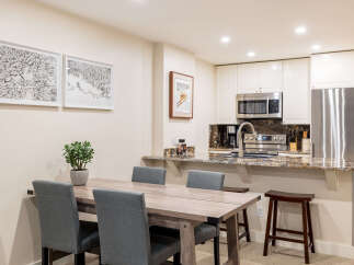 This stunning kitchen and dining area offers a perfect blend of style and functionality.