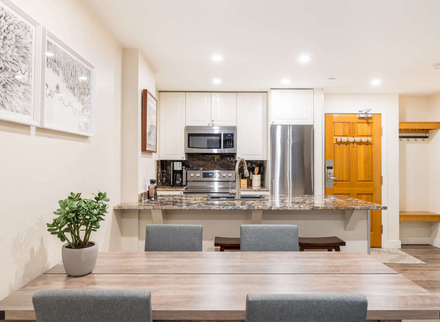 This stunning property features a modern kitchen with stainless steel appliances and granite countertops, perfect for culinary enthusiasts.