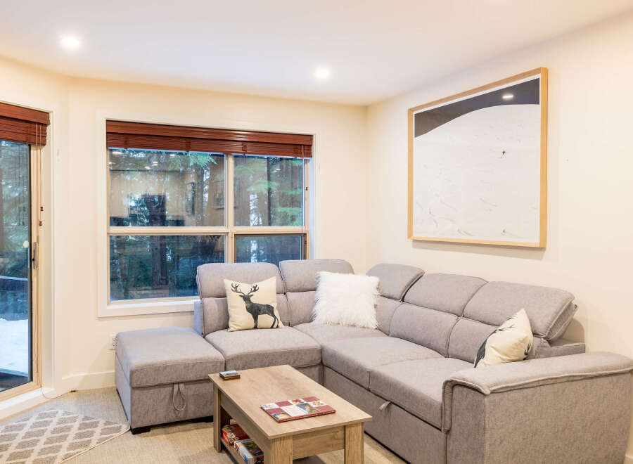 This cozy living room features a comfortable sectional sofa, perfect for relaxing after a long day.