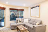 This cozy living room features a comfortable sectional sofa, perfect for relaxing after a long day.