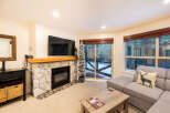 Experience cozy living in this stunning property featuring a stone fireplace, perfect for chilly evenings.