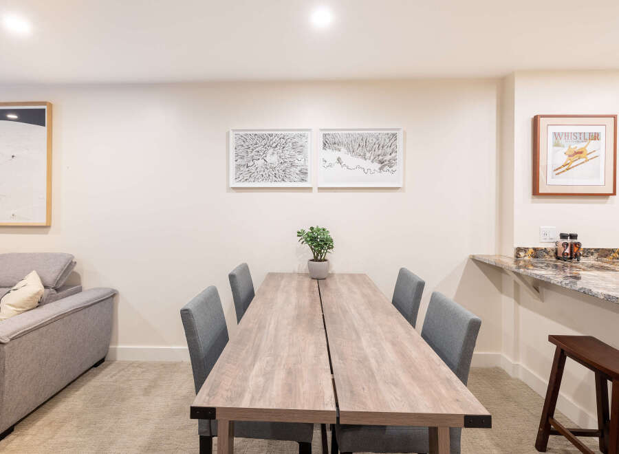 This stunning property boasts a modern dining area, perfect for entertaining guests.