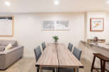 This stunning property boasts a modern dining area, perfect for entertaining guests.