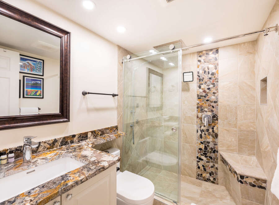 Step into luxury with this beautifully designed bathroom! Featuring a stunning granite countertop, a modern glass shower, and elegant tile work, this space exudes sophistication.