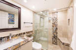 Step into luxury with this beautifully designed bathroom! Featuring a stunning granite countertop, a modern glass shower, and elegant tile work, this space exudes sophistication.