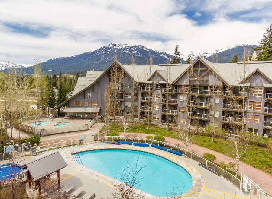 Discover luxury living in this stunning property, featuring a beautiful outdoor pool and breathtaking mountain views.