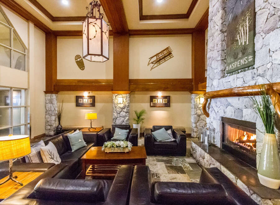 Step into a cozy lodge-style living space, perfect for relaxing and entertaining.