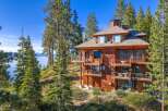 Nestled amidst towering pines, this stunning property offers breathtaking views of the lake.