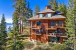 Nestled amidst towering pines, this stunning multi-story home offers breathtaking views of the lake and surrounding mountains.