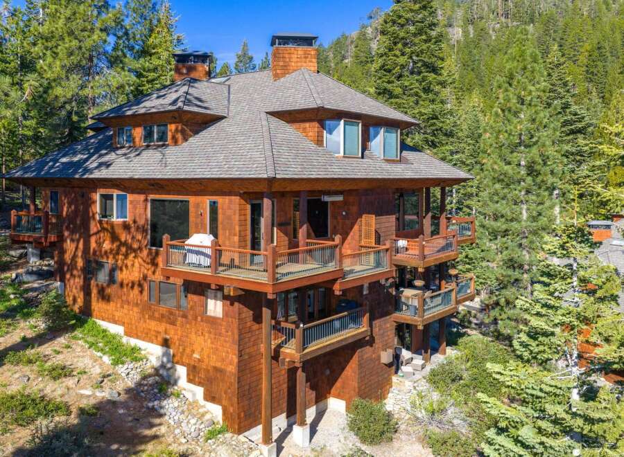 Nestled amidst lush greenery, this stunning property boasts a unique architectural design.