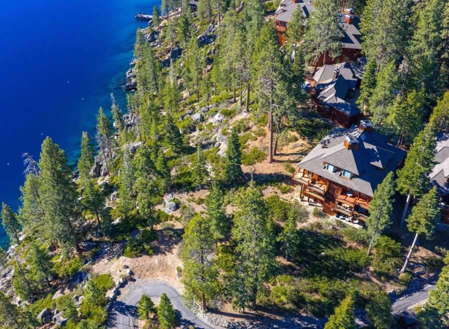 Nestled along the serene shoreline, this stunning property offers unparalleled views of the crystal-clear waters.
