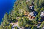 Nestled along the serene shoreline, this stunning property offers unparalleled views of the crystal-clear waters.