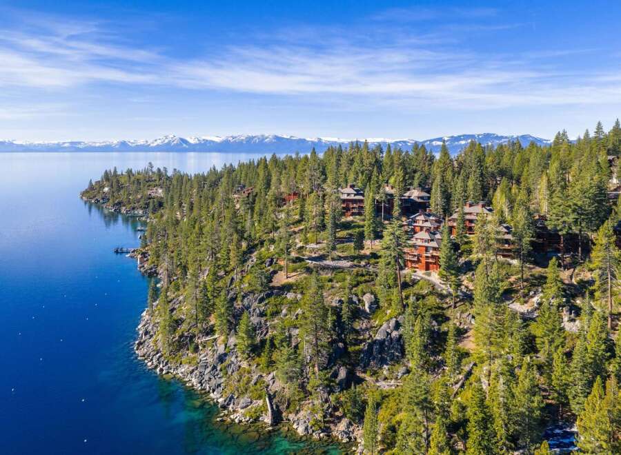 Nestled along the serene shoreline, this stunning property offers unparalleled views of the crystal-clear lake and majestic mountains.