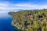 Nestled along the serene shoreline, this stunning property offers unparalleled views of the crystal-clear lake and majestic mountains.