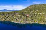 Nestled along the serene shoreline, this stunning property offers unparalleled views and luxurious living.