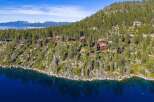 Nestled along the serene shoreline, this stunning property offers unparalleled views and luxurious living.