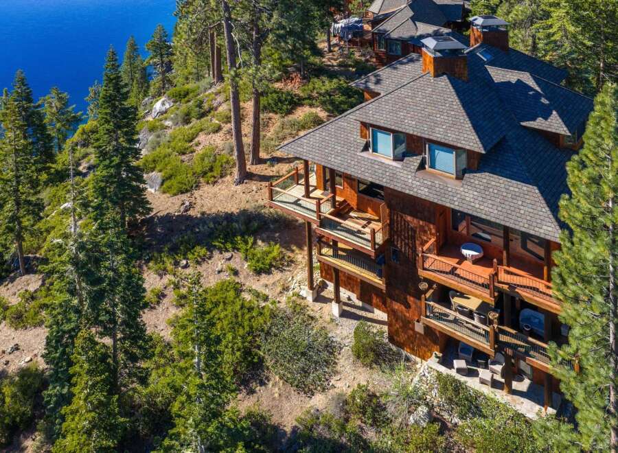 Nestled on a hillside overlooking the serene waters, this stunning property offers unparalleled views and luxurious living.