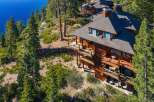 Nestled on a hillside overlooking the serene waters, this stunning property offers unparalleled views and luxurious living.