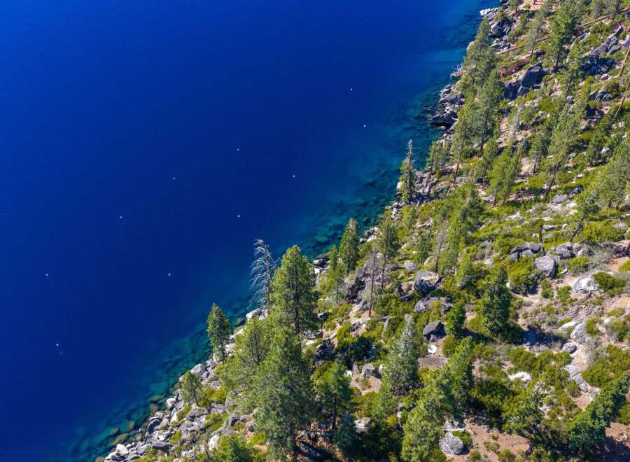 Experience the breathtaking beauty of this stunning property nestled along the serene shoreline.