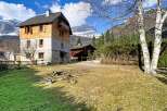 Discover a stunning property nestled in a picturesque mountain setting.