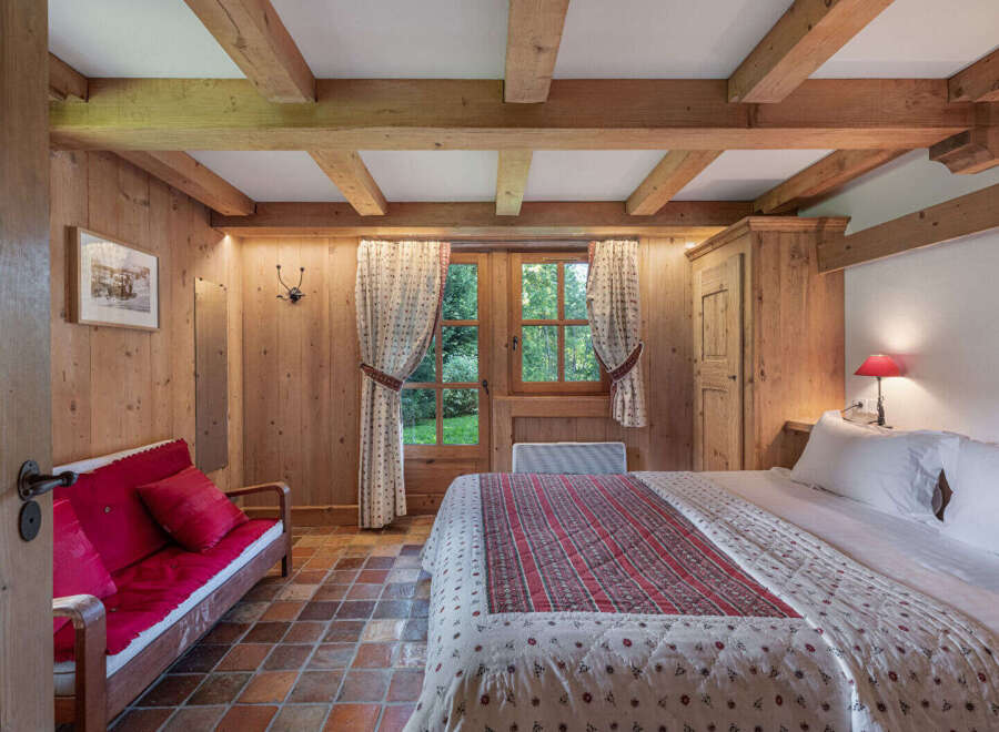 Step into a cozy bedroom retreat, where rustic charm meets modern comfort.