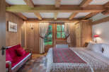 Step into a cozy bedroom retreat, where rustic charm meets modern comfort.