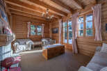 Step into a cozy mountain retreat with this charming living space.