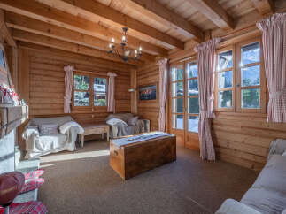 Step into a cozy mountain retreat with this charming living space.