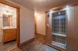 Discover the ultimate relaxation in this stunning property featuring a private sauna and a well-appointed bathroom.