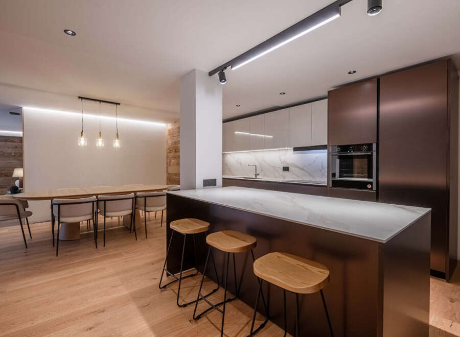 This stunning modern kitchen boasts sleek design and high-end finishes, perfect for culinary enthusiasts.