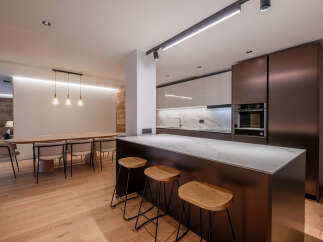 This stunning modern kitchen boasts sleek design and high-end finishes, perfect for culinary enthusiasts.